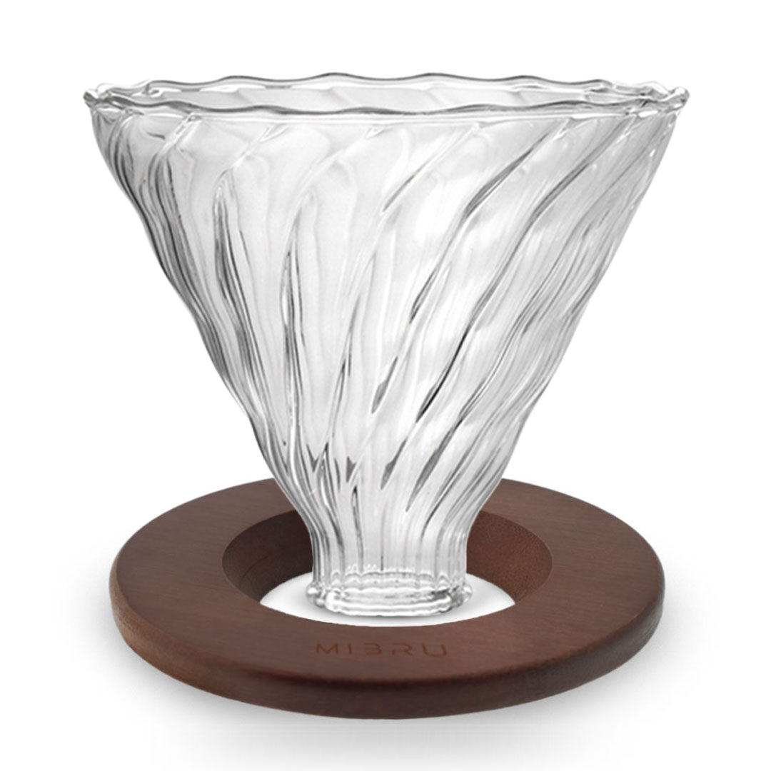 A V60 glass coffee drip funnel with a wooden base